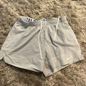 Nike grey shorts with biker shorts included